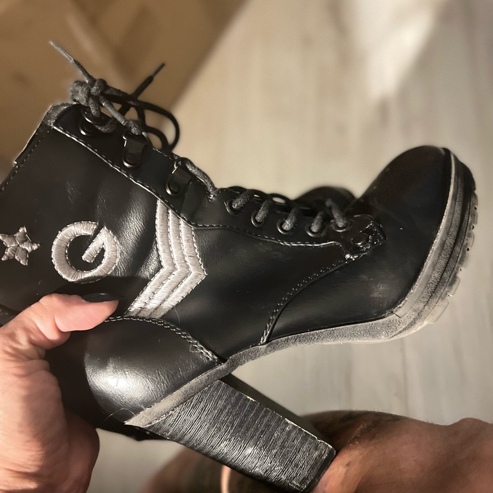 Size 6 lace up and zipper ankle Boots by Guess